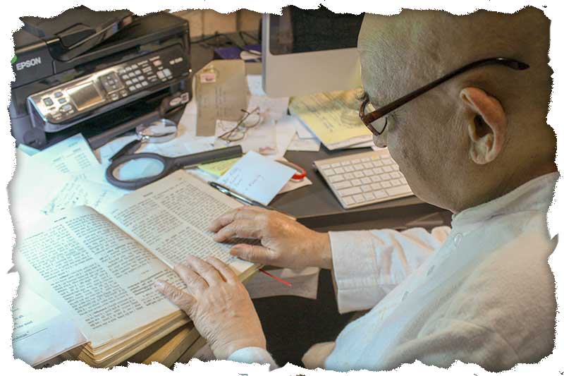 Swami Jyotirmayananda reading scriptures of the Vedas.